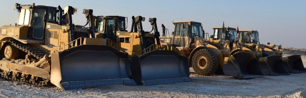 Bulldozer and loader fleet at a project yard